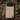 Colorful decorative phone cases set on a rich, patterned fabric background showcasing folk art elements.