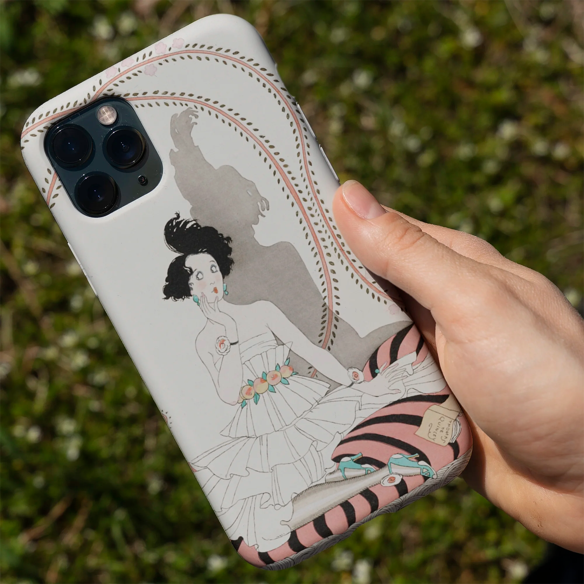 Colorful floral-patterned phone case for an iPhone.