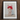 Framed artwork depicting a figure wearing white underwear and a red bull-horned headdress covering their head.