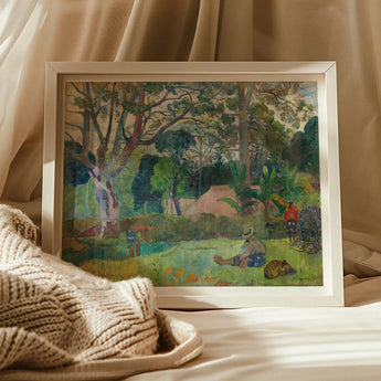 Framed painting depicting a lush tropical landscape with figures in a garden-like setting.