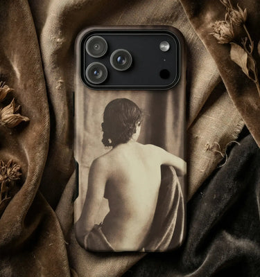 Lesbian Phone Cases displayed on a dark background with vintage decor, featuring artful photography.