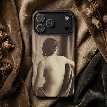 Lesbian Phone Cases displayed on a dark background with vintage decor, featuring artful photography.