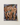 A marsden hartley rectangular canvas painting depicting four nude figures in earthy tones with blue swim trunks and leaf accessories