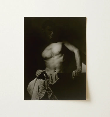 Black-and-white Photographic Print Muscular Man Shadowy Lighting Fabric Revealing Taut Muscle, Elemental Contrasts, Shoulder Arcs