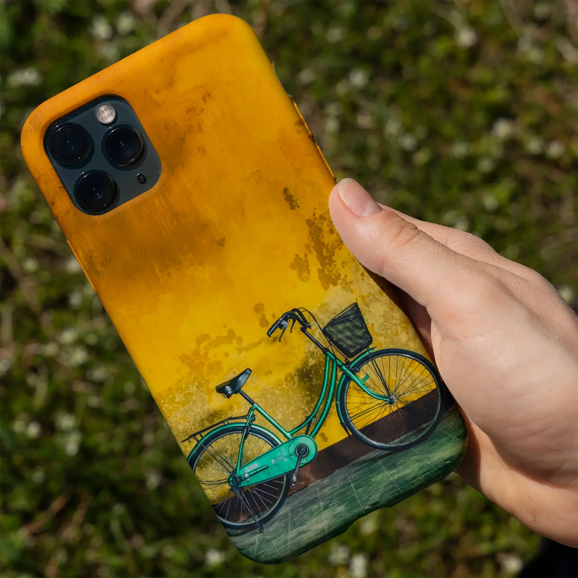Yellow phone case with bicycle design.
