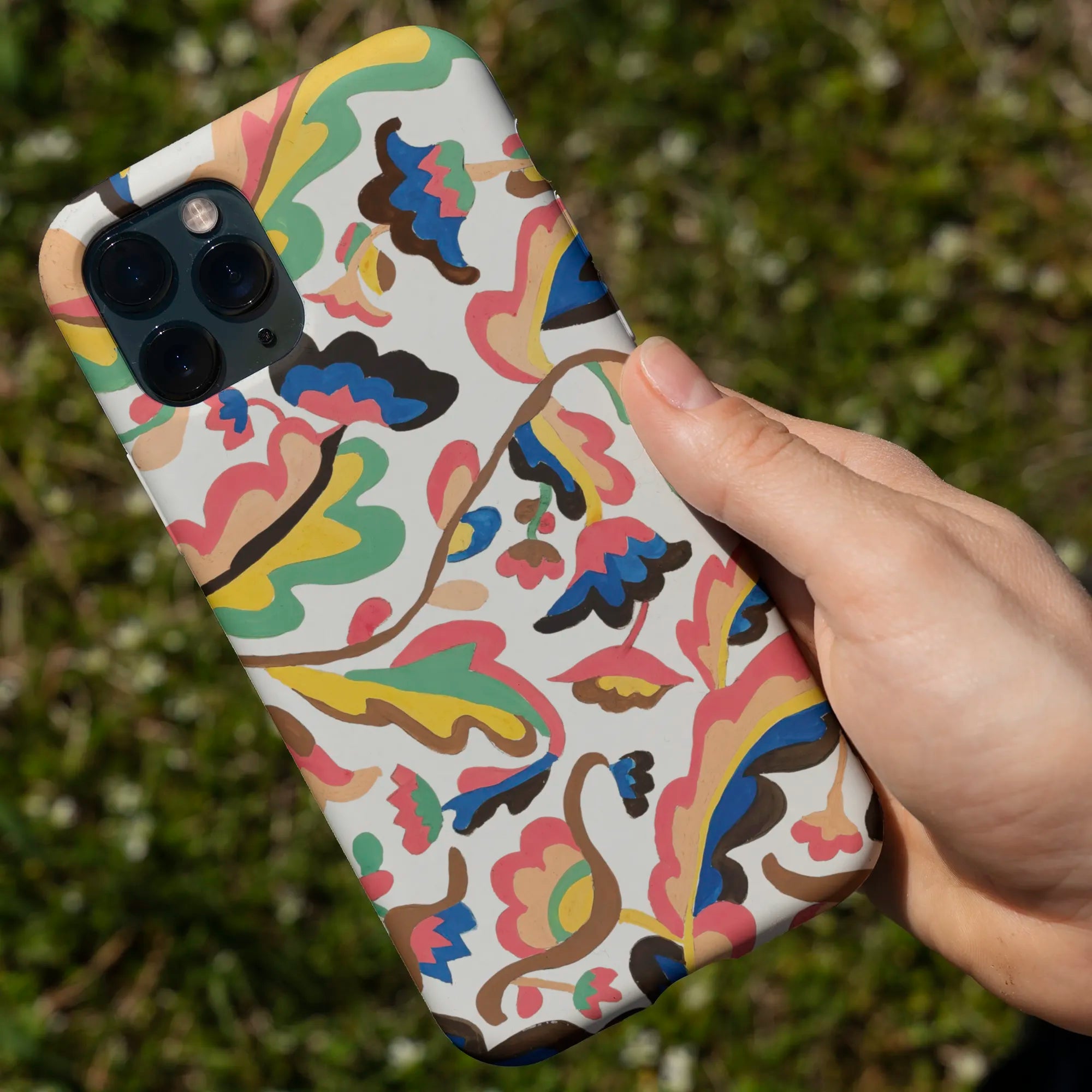 Colorful abstract patterned phone case for an iPhone.