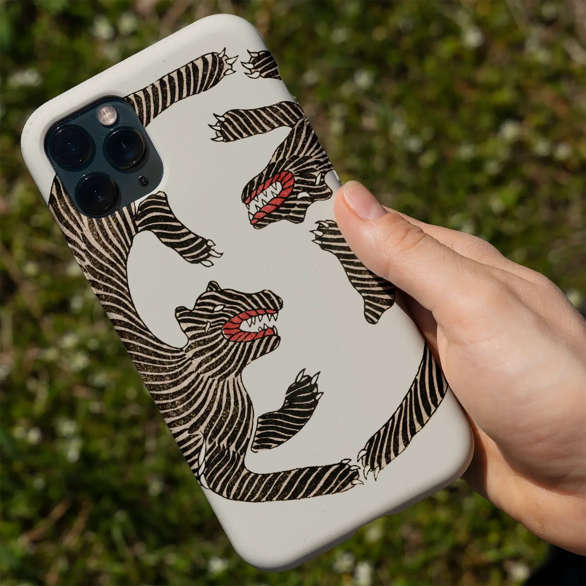 White phone case with tiger design.