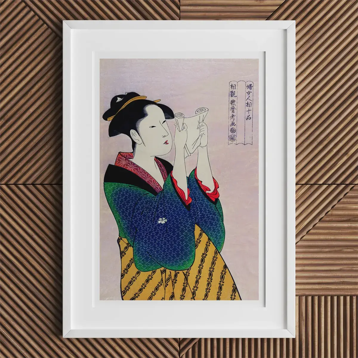Framed Japanese woodblock print by Kitagawa Utamaro showcasing ukiyo-e beauty.