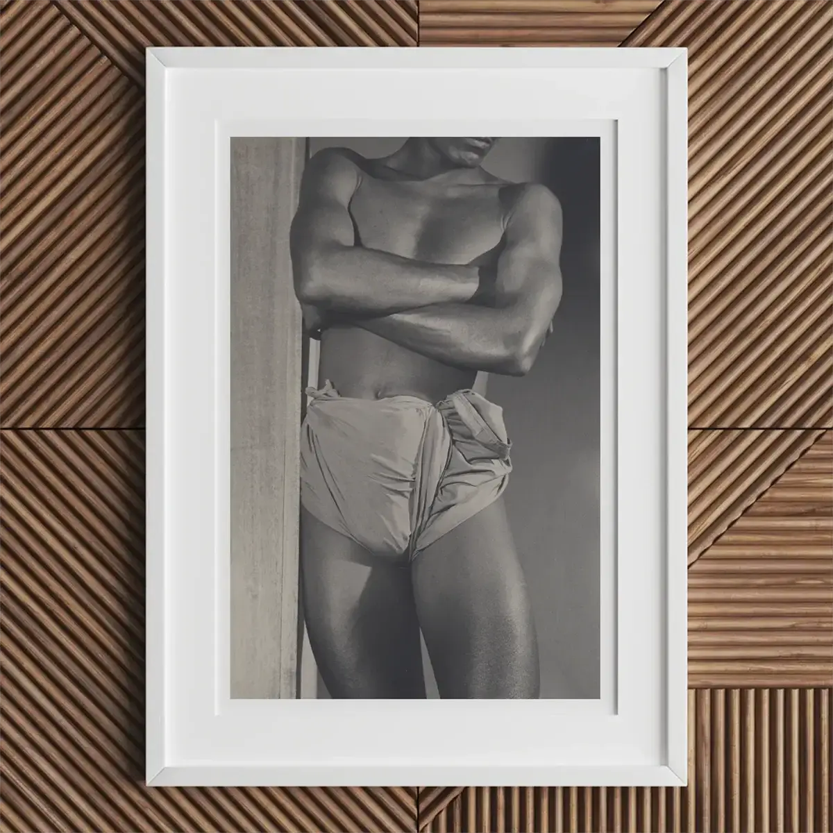 Framed black and white photo of a muscular man from Lionel Wendt’s work in Wendt’s Ceylon