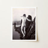 A black and white art print depicting a classical nude male figure standing on dark rocks by a body of water
