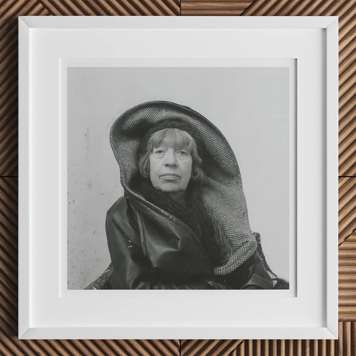 Black and white portrait of a person in a large hat and dark coat, inspired by Andy Warhol style