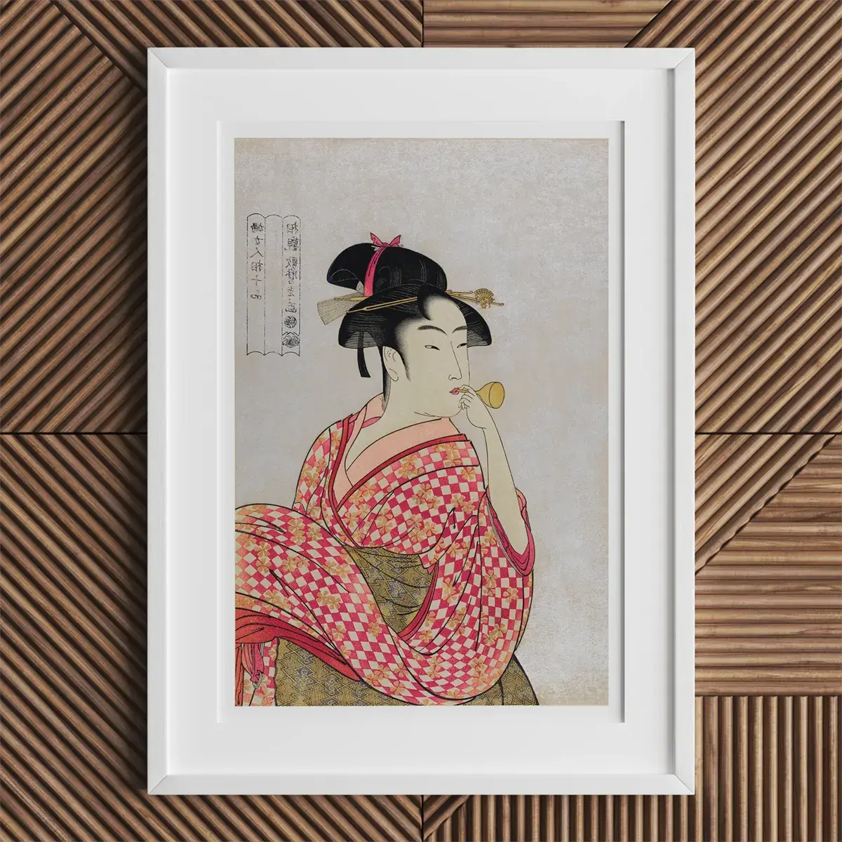 Framed Japanese art print showcasing Kitagawa Utamaro’s ukiyo-e printmaking style.