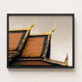 Framed Photograph Traditional Thai Temple Roof Ornate Golden Cambodian Photography, Temple’s Embodies Timeless Grandeur, Brooding Sky Over