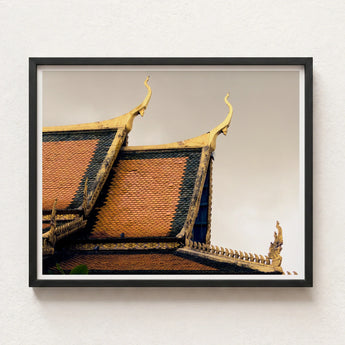 Framed Photograph Traditional Thai Temple Roof Ornate Golden Cambodian Photography, Temple’s Embodies Timeless Grandeur, Brooding Sky Over