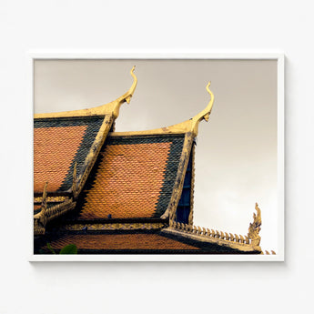 Framed Photograph Traditional Thai Temple Roof Ornate Golden Cambodian Photography, Temple’s Embodies Timeless Grandeur, Brooding Sky Over