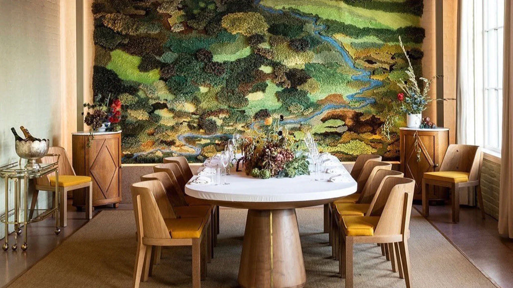 Elegant dining room showcasing minimalist maximalist design with striking statement pieces.