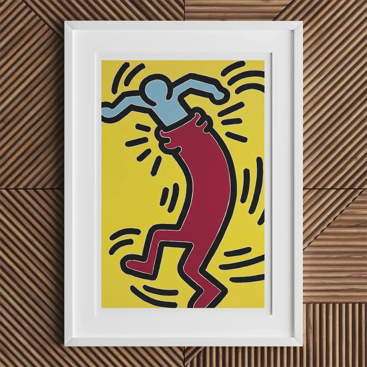 Ingelijste Keith Haring kunstwerk dat levendige LGBTQ+ kunst en popart invloeden toont.