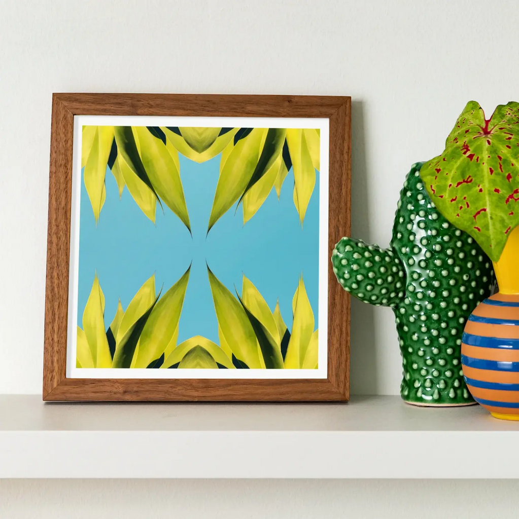 Framed abstract artwork of symmetrical botanical op art featuring a trippy tree trunk design