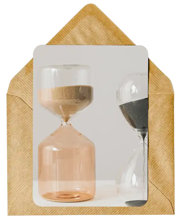 Hourglass with sand flowing through its glass chambers.