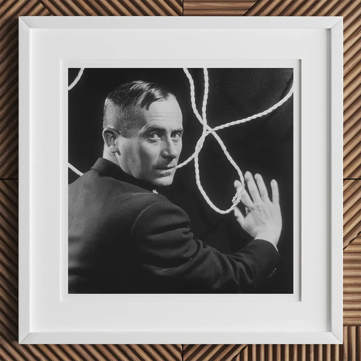 Framed black and white portrait of a man with a rope inspired by Andy Warhol and Chuck Close