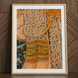 Framed Thai mural art print of a lady's patterned fabric.
