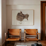 Leather Saddle - Bertha Semple Equestrian Art Print, Two Tan Leather Wood Armchairs Positioned Beneath Framed