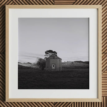 Lonely Brick House Art Print / Canvas Framed Black White Photograph Round Tree Roof with Muted Silver, Blank Sky Cloud Cover, Light Seeps