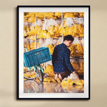 Marigolden - Bkk Flower Market Marigolds Art Print, Person Stacks Yellow Plastic-wrapped Packages Storage Market