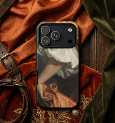 A phone case featuring a classical painting print of a figure in a white dress holding an orange-red fabric, styled on a dark wood surface with draped rust-orange velvet, olive green velvet, and a brown leather strap.