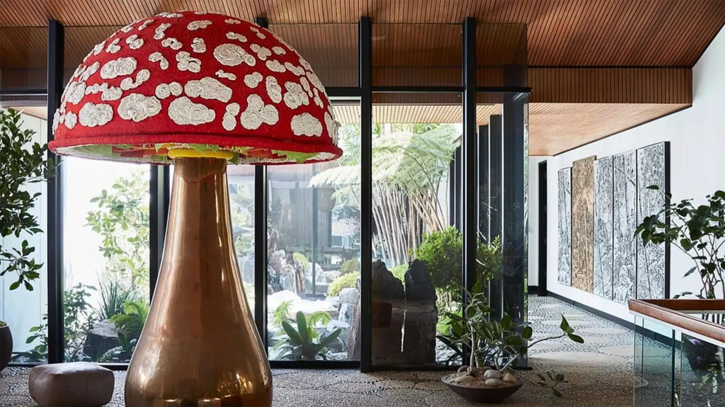 Oversized mushroom lamp as a statement piece in minimalist maximalist design interior.