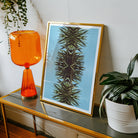 Pointy Modern Mirrored Botanical Leaf Art Print, Framed Artwork Symmetrical Palm Frond Pattern Blue Background