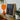 Framed Concert Photograph Alongside Orange Glass Table Lamp Gay Black Dracula, Art, Commanding Presence