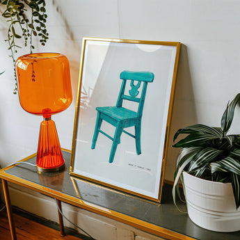Turquoise Chair - Majel G. Claflin Decorative Art Print, Orange Glass Table Lamp Ribbed Base Wide Shade