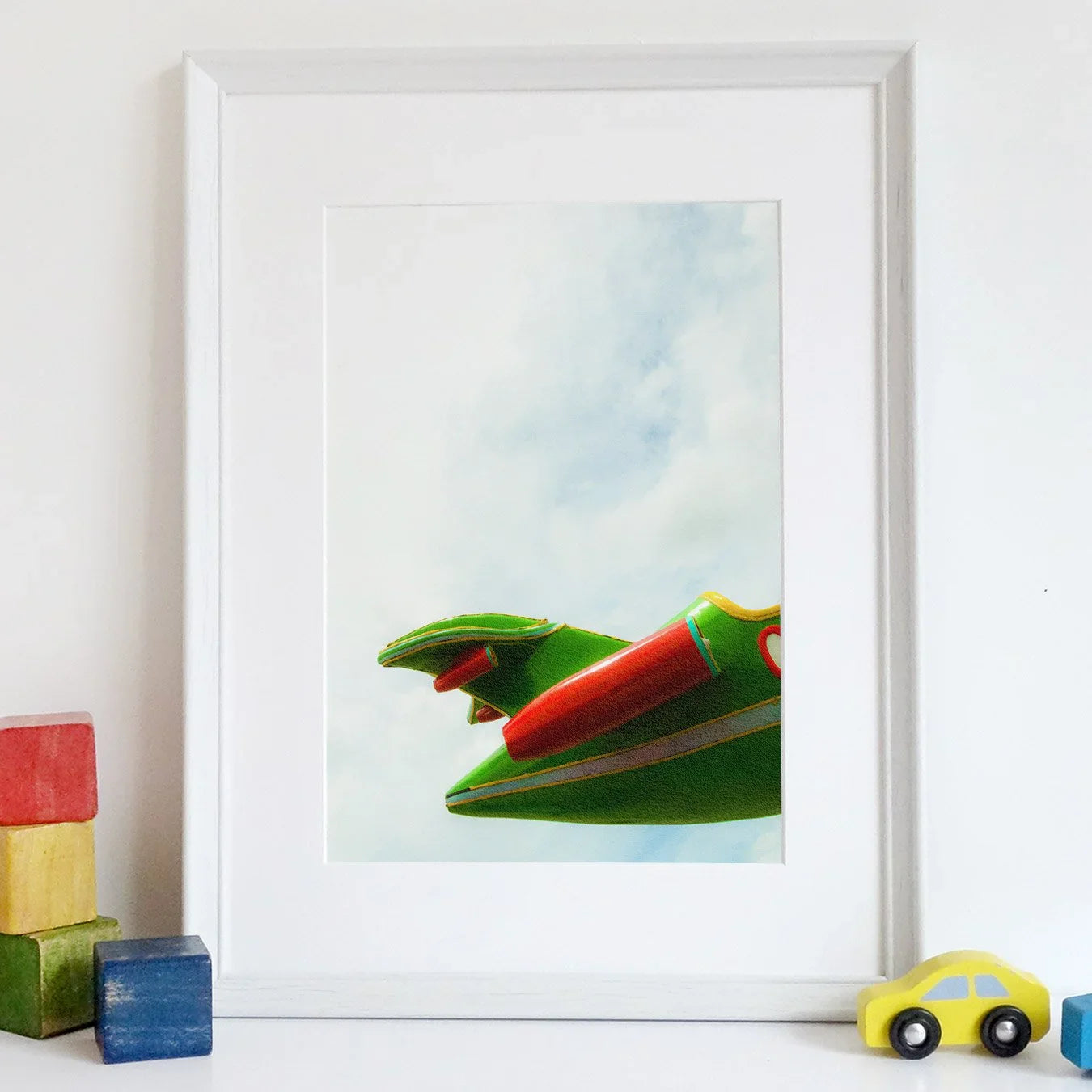 Up in the Air Giclée Print, 12×16 / Unframed Art, Framed Artwork Colorful Toy Frog Dragon Head Pale