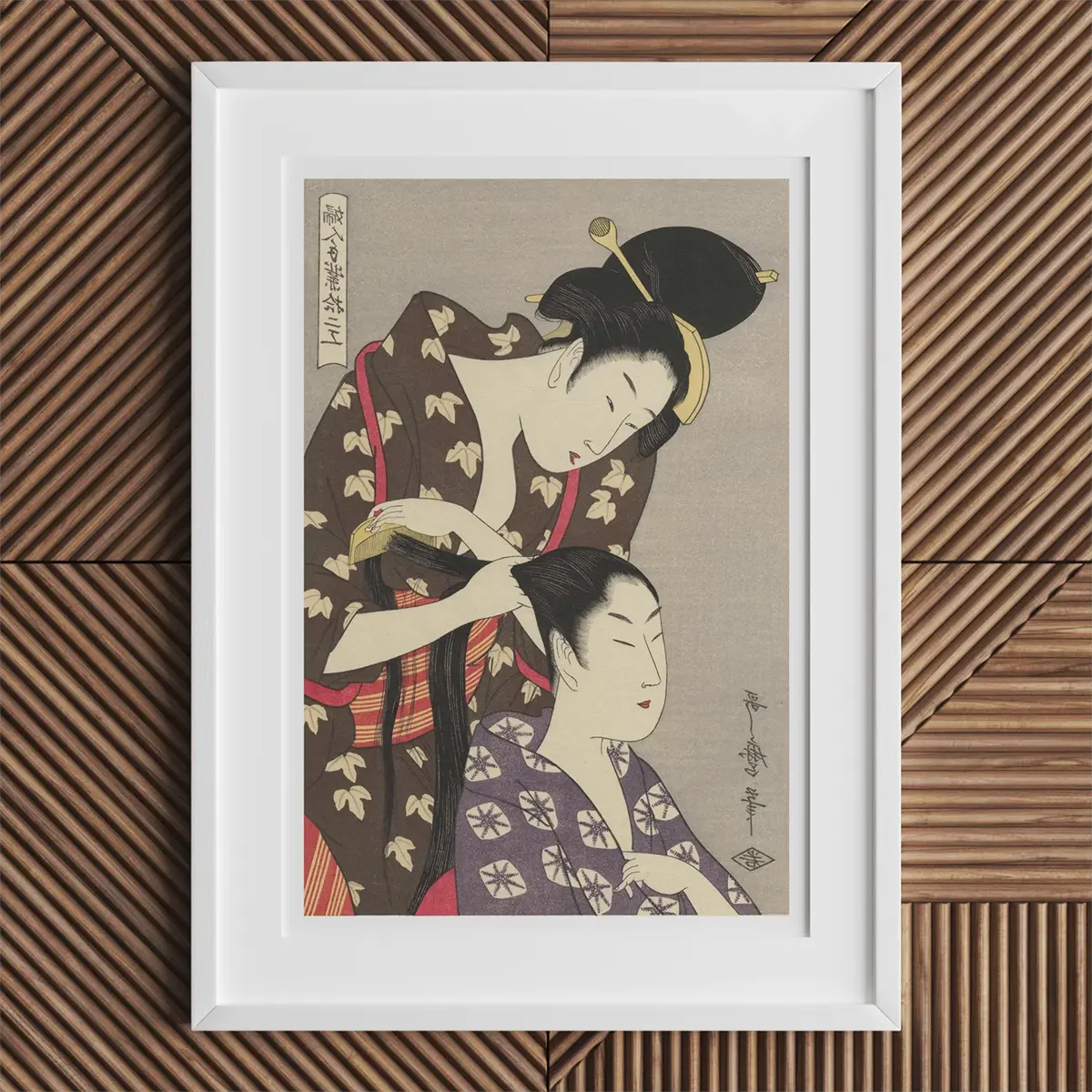Framed Japanese woodblock print by Kitagawa Utamaro showcasing ukiyo-e printmaking.