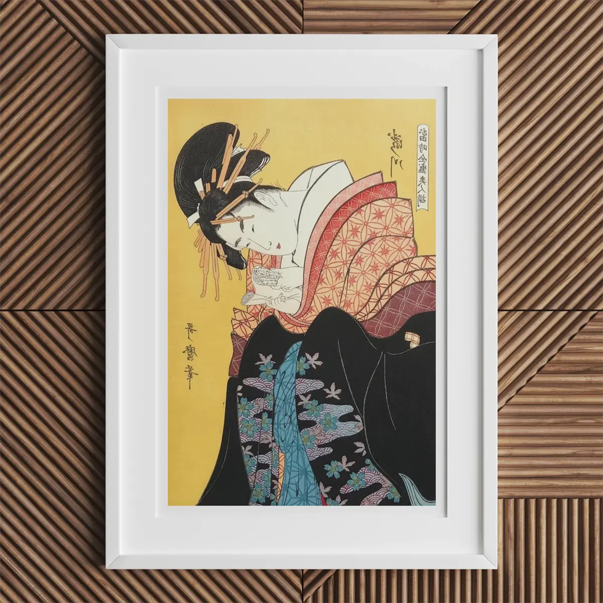 Framed Japanese art print showcasing Kitagawa Utamaro’s ukiyo-e printmaking style.