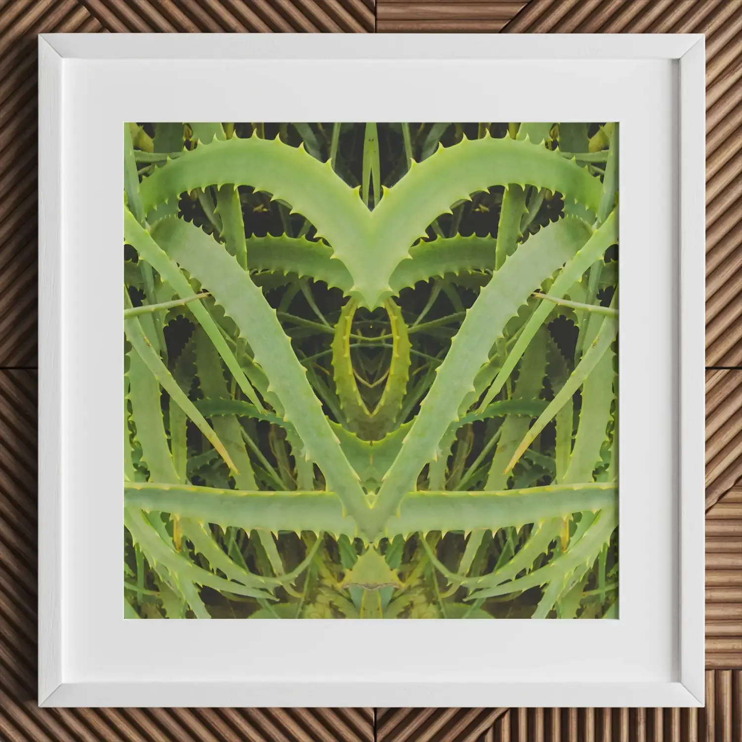 White framed botanical op art print of symmetrical green aloe vera heart