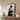 Black-framed Portrait Man Dark Attire Wooden Console Table John Singer Sargent, Introspective Gaze, Serene White Backdrop